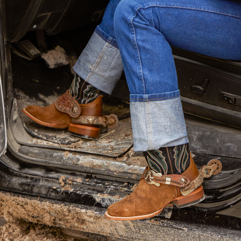 A woman wearing the Justin Palisade 13” Western Boot in clay brown. Shop Palisade