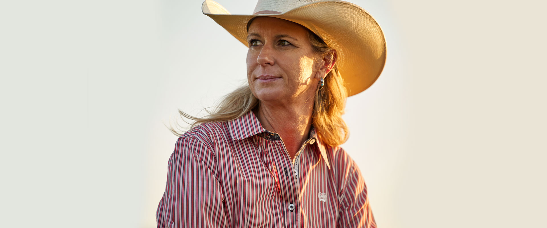 Sherry wearing cowboy hat and button up