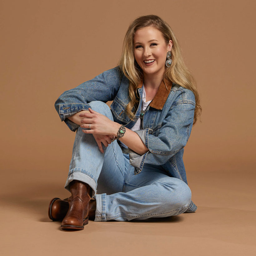 A woman wearing the Holland 10" Roper boot in brown.