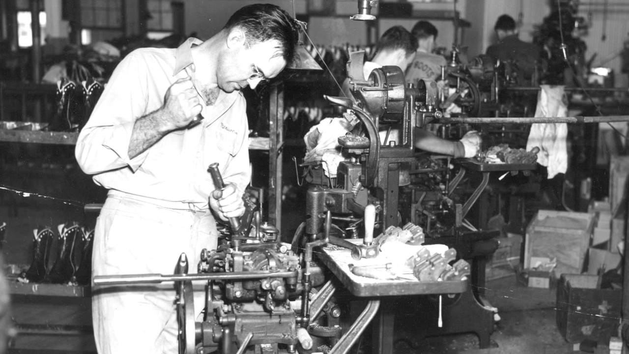 Man uses intricate machine in Justin boot making process