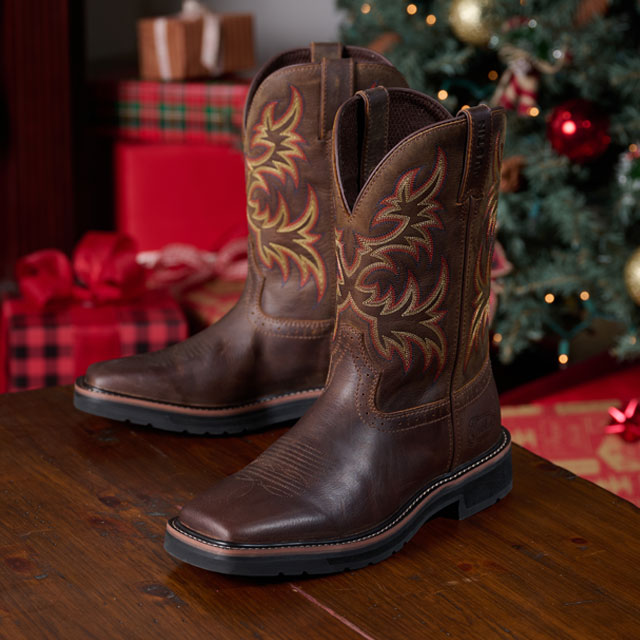 Justin Boots Driller 11-inch Waterproof Steel Toe Work Boot in Brown showcased in a cozy holiday setting. Shop Driller.