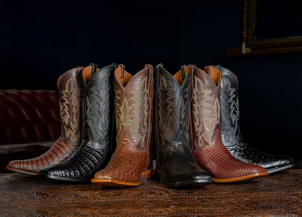 Panama 12" Caiman Cowboy in black and brown, Rancher 12" Ostrich Cowboy in black and brown, Reposado 12" Lizard Cowboy in black and brown posed in a circle.