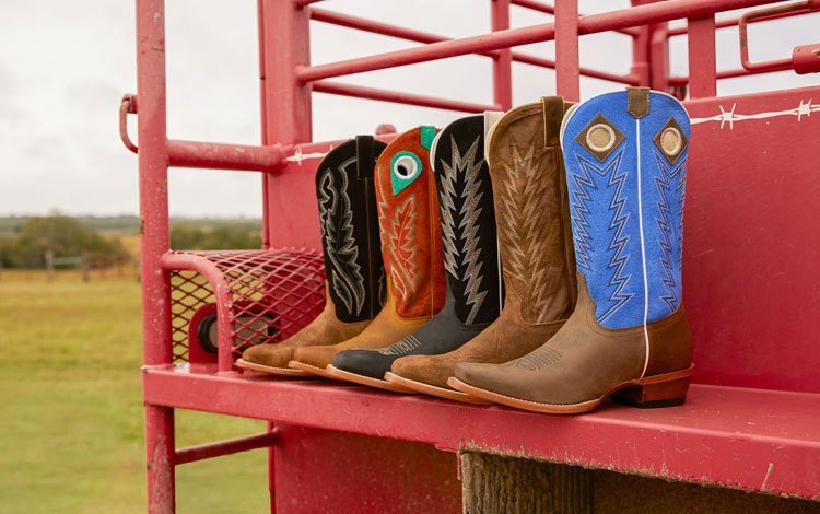 5 boots sitting on a red trailer, positioned into a fan.