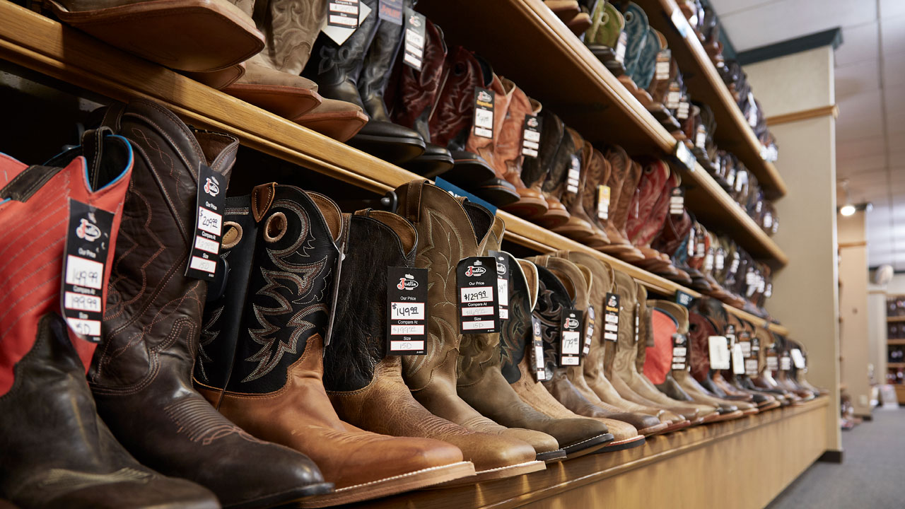 Men's boot lineup on a shelf