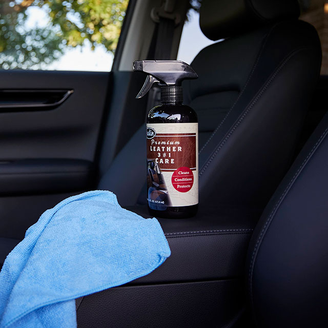 Justin Boots’ Premium Leather 3-in-1 Care in the front seat of a car. Shop Justin Boots’ 3-in-1 Premium Leather care.